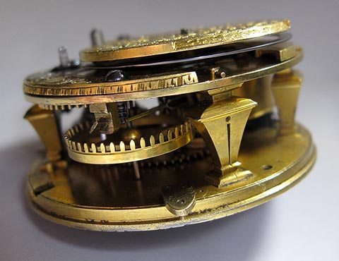 Antique verge escapement table clock, driven by a fusee and chain. Side view.