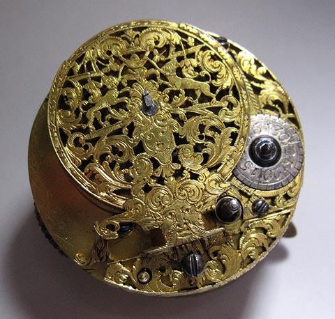 Antique verge escapement table clock, driven by a fusee and chain. Top view showing the skeletonized balance bridge.