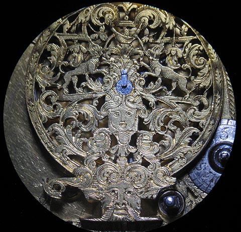 Close-up of the skeletonized balance bridge. Antique verge escapement table clock, driven by a fusee and chain.