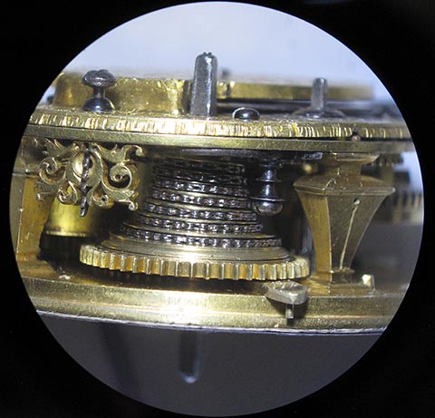 Close-up of the fusee and chain. Antique table clock featuring a verge escapement mechanism.