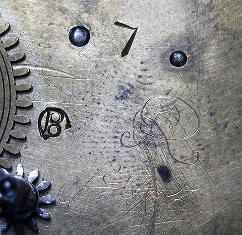 Close-up of the signature on the movement. Antique verge escapement table clock with fusee and chain.