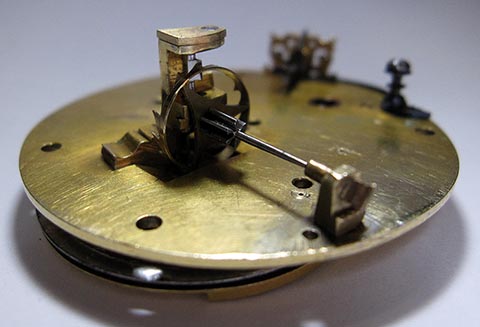 The verge escape wheel. Antique table clock with verge escapement and fusee-and-chain drive.