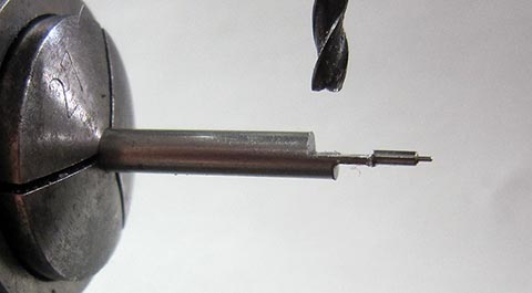 Manufacturing the long pallet of the balance staff on a milling machine. Antique verge escapement table clock with fusee and chain.