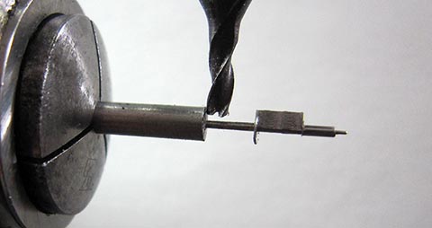 Alternative view of milling the 0.6 mm diameter balance staff. Antique table clock featuring a verge escapement mechanism.