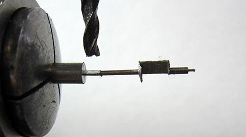 Antique verge escapement table clock with fusee and chain. Milling the short pallet of the balance staff on a milling machine.