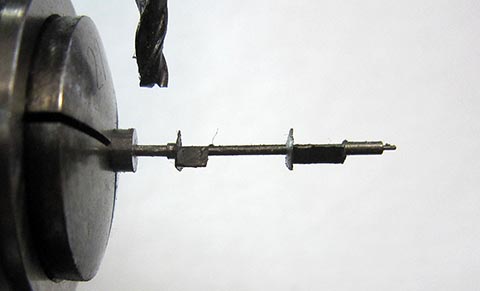 Milling the balance staff. Antique verge escapement table clock, driven by a fusee and chain.