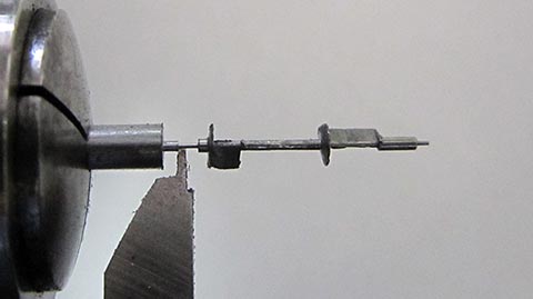 Manufacturing the balance staff with pivot on a lathe. Antique verge escapement table clock with fusee and chain.