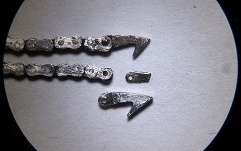 Manufacturing the hook and pin (Ø 0.32 mm × 0.6 mm) for the fusee chain. Antique table clock with verge escapement and fusee-and-chain drive.