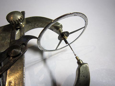 New bushing. Centering and poising the balance. Antique verge escapement table clock, driven by a fusee and chain.