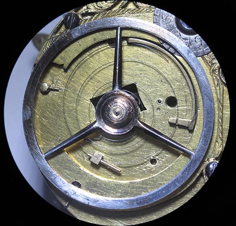 Restored balance with hairspring installed in the movement. Antique verge escapement table clock.