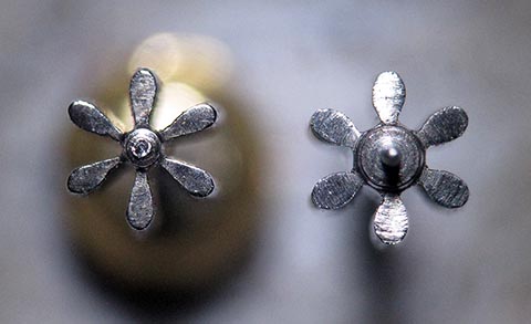 Antique verge escapement table clock with fusee and chain. Newly manufactured pinion compared to the old one. Top view.