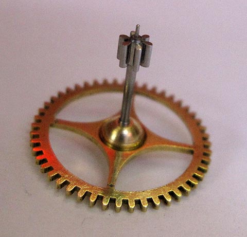 Gear wheel with a new pinion and new brass bushing. Antique table clock with verge escapement and fusee-and-chain drive.