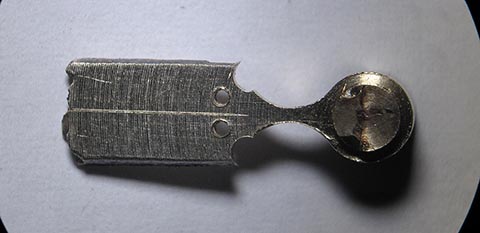 Symmetry line for the outlines of the future leaves and marking for holes. Antique fusee bracket clock. Manufacturing the hour hand.