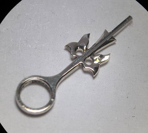 Antique fusee bracket clock. Manufacturing the hour hand. Final polished and finished gold hour hand.