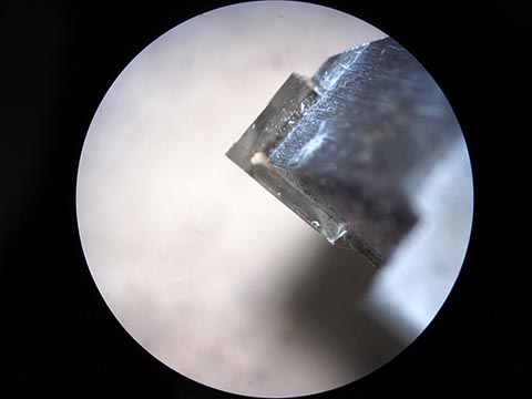 Industrial diamond, sharpening a diamond cutter under the microscope.