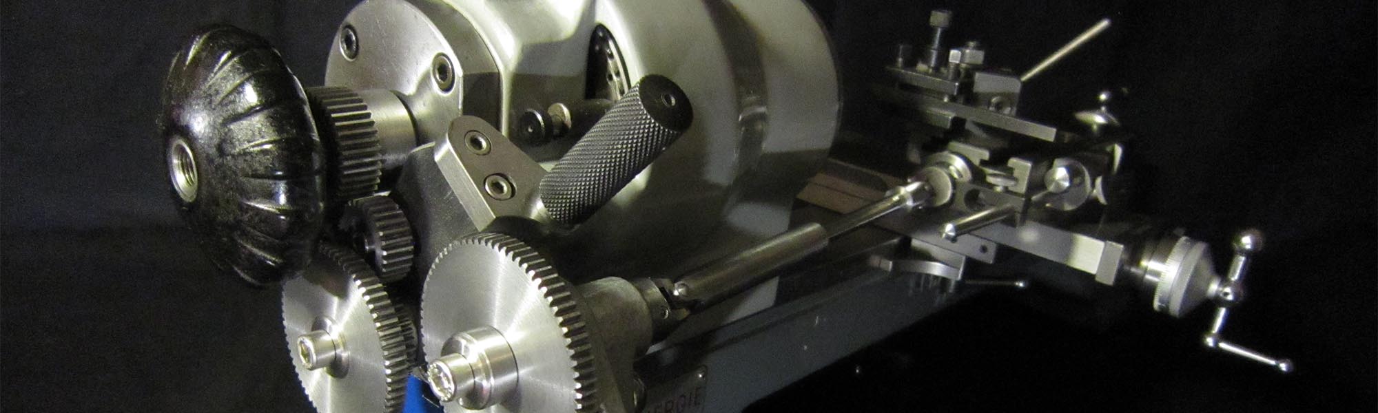 Screw-cutting attachment mounted on a Schaublin 70; an exclusive device designed and manufactured by Alexander Babel. Open spindle.