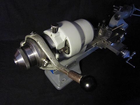 Schaublin 70 with rear-drive spindle, quick-clamping attachment for workpieces in the headstock, cross slide.